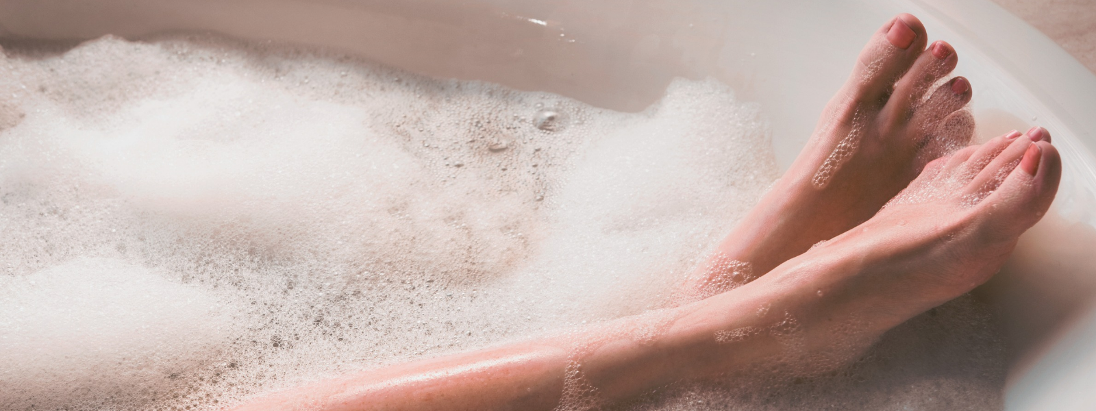 Woman's feet enjoying a luxury bath ritual at home